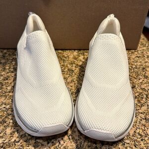 Brand new white knit sneaker. Size 7.5. Has silver trim.